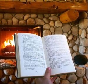 Patmos Library| image: reading-book-by-fire